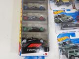a lot of hot wheels cars on the table