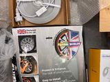 a box with a fan and other items on the floor