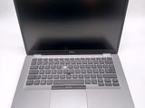 an open laptop computer sitting on top of a white table
