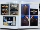 an open book with pictures of military uniforms on it