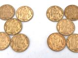 several gold coins are arranged in the shape of the letter h