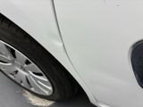 a close up of a car ' s front tire with a hole in the tire