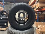 several tires stacked on top of each other in a warehouse