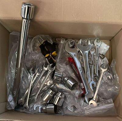 a box full of wrenches and other tools in it