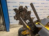 a machine that is sitting on the ground in front of a wall