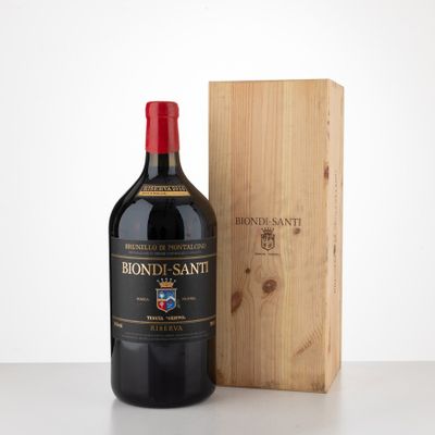 the bottle of red wine is next to a wooden box