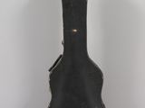 a black guitar case sitting on a white table