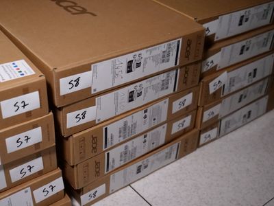 several boxes stacked on top of each other on a tiled floor