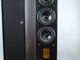 two speakers are sitting next to each other on a white surface