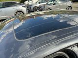 many cars parked in a parking lot next to each other