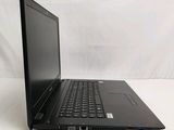 an open laptop computer sitting on top of a white table
