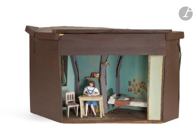 a small doll house with a doll sitting in it