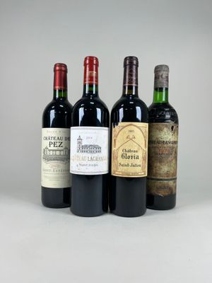 trois bouteilles de vin sont alignées sur une surface blanche