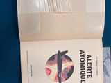 a book with a picture of a surfer on it