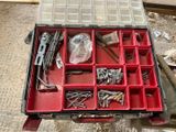 a tool box filled with assorted screws and nuts