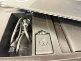 a car charger that is plugged into a car ' s trunk