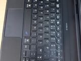 two laptops sitting side by side on a table