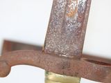 a close up of a knife with a rusted handle