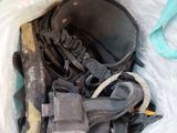 a bag full of assorted items sitting on the ground