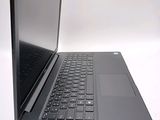 a black laptop with a black keyboard on a white surface