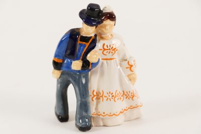 a figurine of a man and a woman standing next to each other