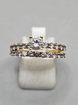 a close up of a ring with a diamond on top of it