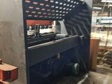 a machine that is working on a piece of metal