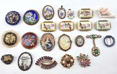 many different pieces of jewelry on a white surface