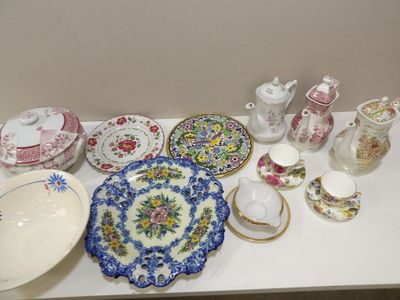 many different types of plates and bowls on the table