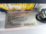 a picture of a car door handle with a tag attached to it