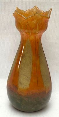 a vase that is sitting on a white surface