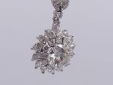 a close up view of a diamond pendant on a chain