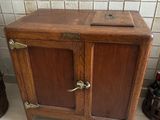 a small wooden cabinet with two doors on it