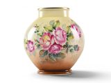 a yellow vase with pink flowers on it on a white background