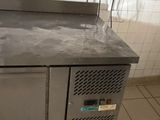 stainless steel counter top in a commercial kitchen with tile flooring