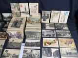 a lot of old postcards sitting on a table