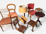 several chairs and a table with a lamp on a white background