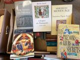a lot of books that are sitting on a table