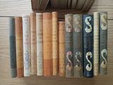 a lot of books that are sitting on a table