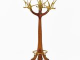 an image of a wooden and brass plated tree on a stand