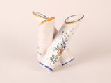 pair of white ceramic vases with blue and yellow designs