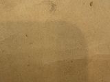 an image of a piece of brown paper with writing on it