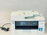 an image of a printer sitting on top of a white table