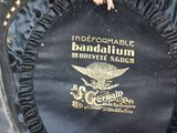 a close up of a black jacket with a gold emblem on it