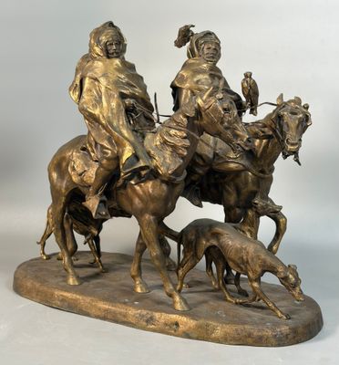 bronze statue of a man on a horse with a dog and a man on a horse with a dog and a man on a horse with a dog