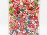 a close up of a bag of assorted lollipops on a white background