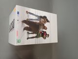 a box with a picture of two people riding horses on it