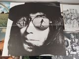 a poster of a man with sunglasses and a hat