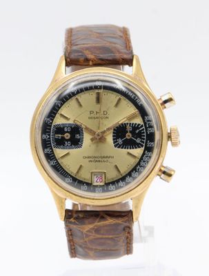 a close up of a wrist watch with a brown leather strap