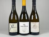 three bottles of wine sitting next to each other on a table